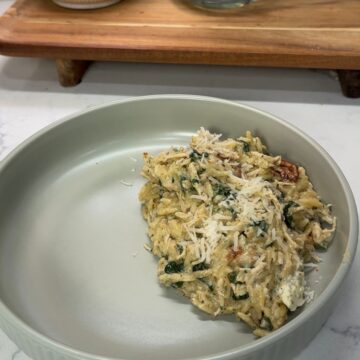 marry me chicken orzo casserole on green dinner plate