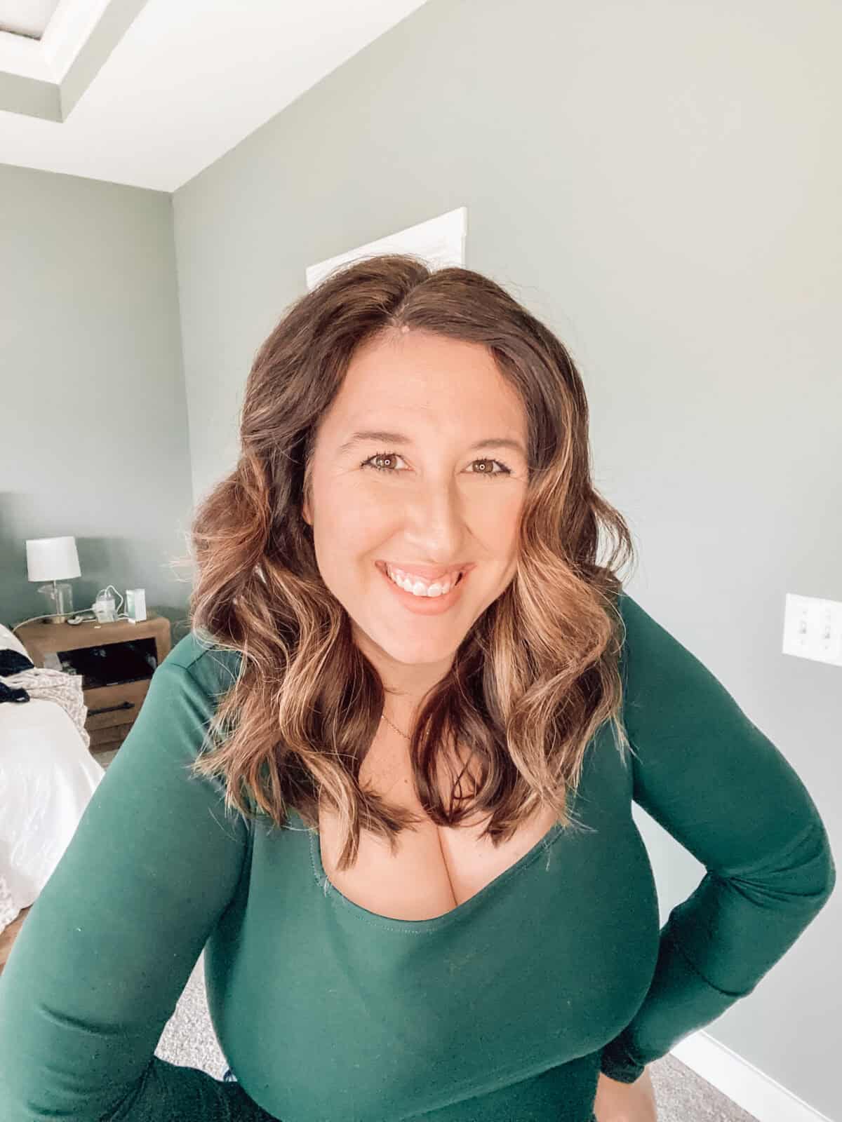 girl in green top smiling