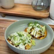 bbq ranch smashed chicken tacos on green plate