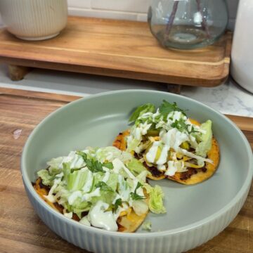 bbq ranch smashed chicken tacos on green plate