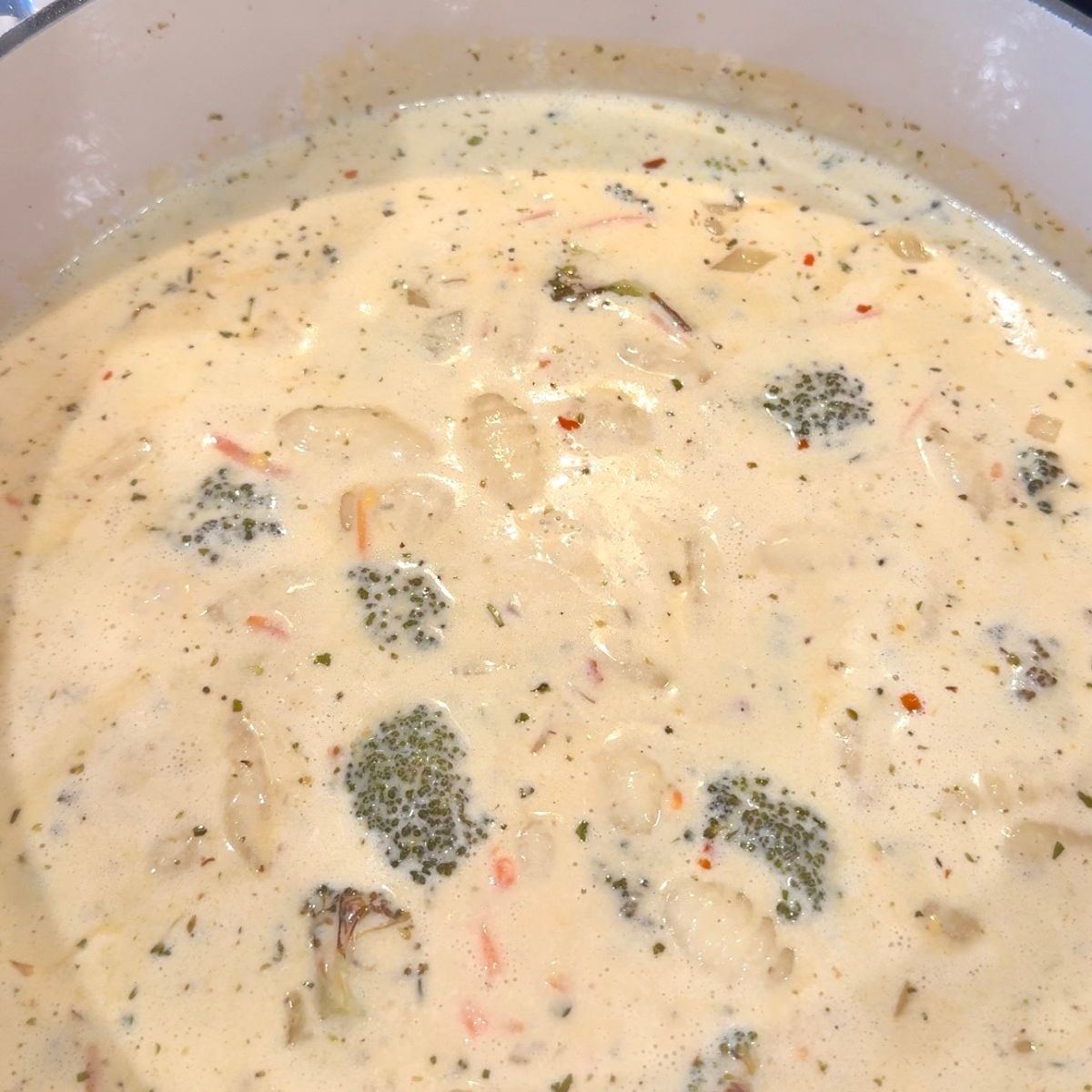 broccoli cheddar gnocchi soup in large pot