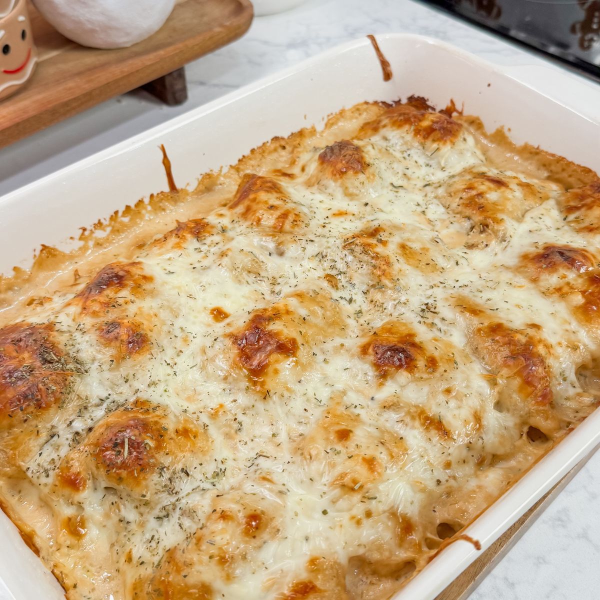 chicken alfredo rollups in casserole dish