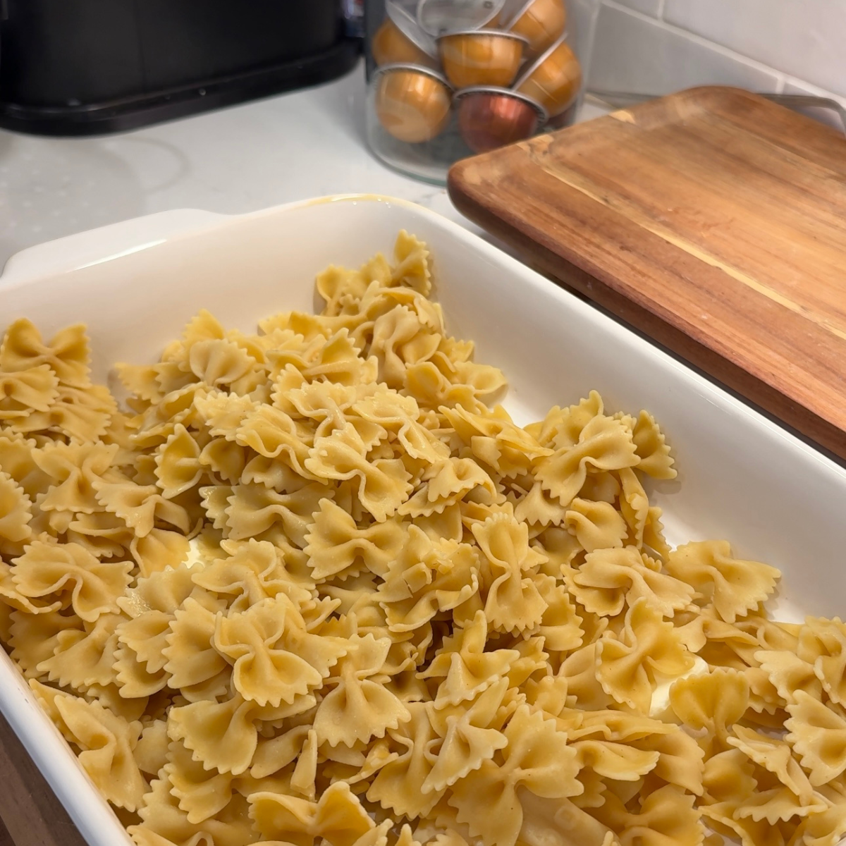 pasta shells and butter in casserole dish