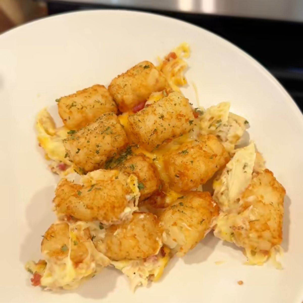 chicken bacon ranch tater tot casserole on cream plate