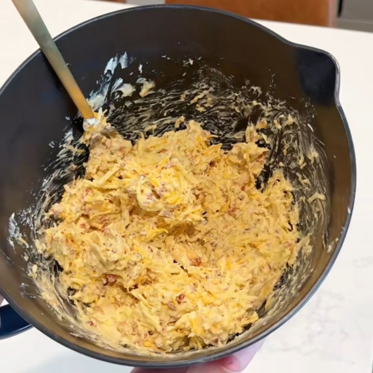 chicken bacon ranch mixture in black mixing bowl