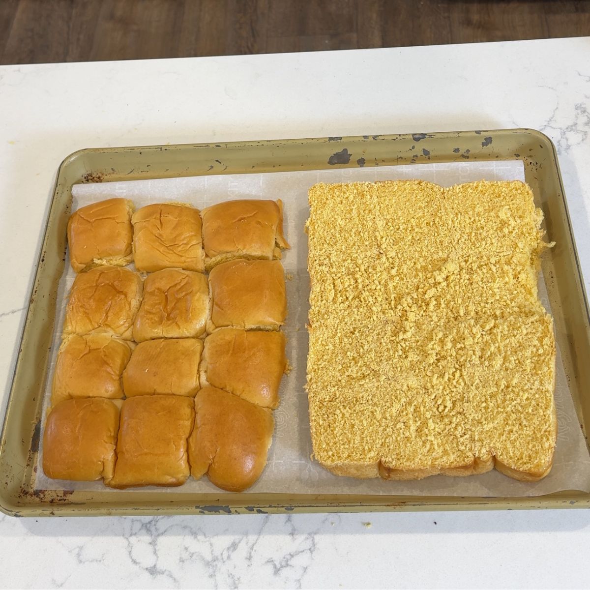 mini slider rolls sliced horizontally and placed on 13x9 tray