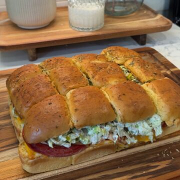 italian grinder sliders on wooden cutting board