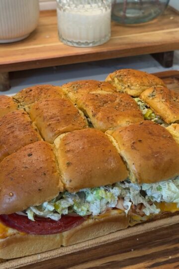 italian grinder sliders on wooden cutting board