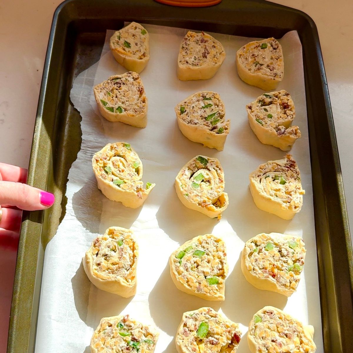 jalapeno popper pinwheels on baking tray