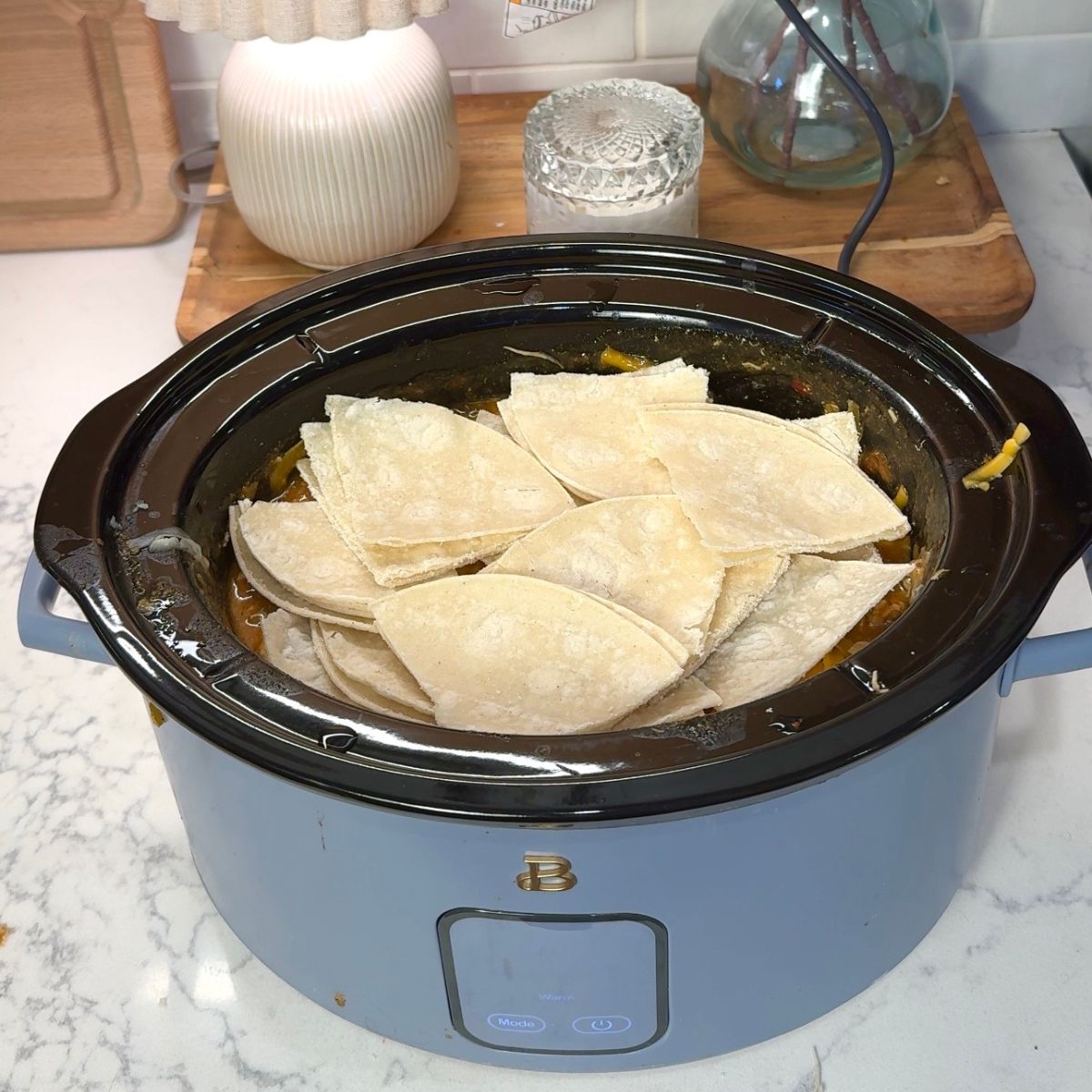 tortillas on top of chicken mixture