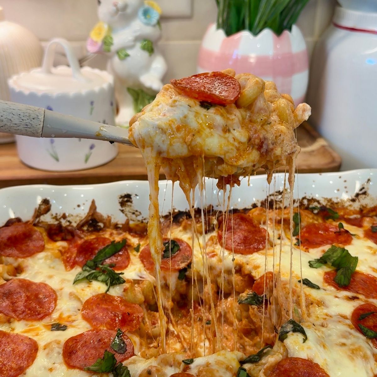 pasta with cheese pull on spoon over casserole