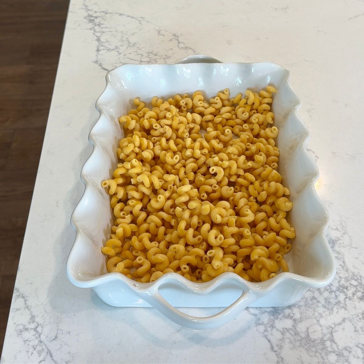 cooked pasta shells in white dish