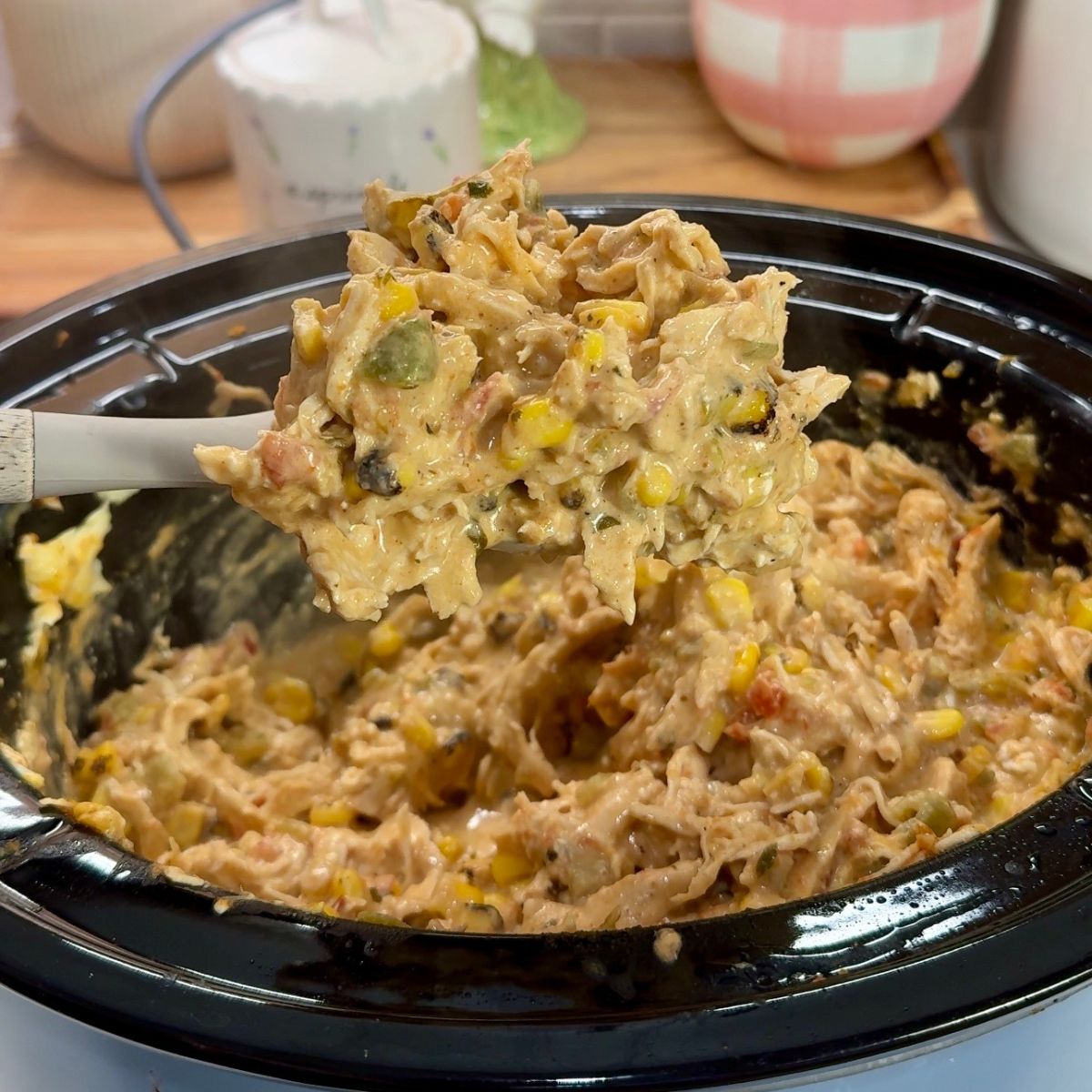 corn and chicken mixture on spoon 