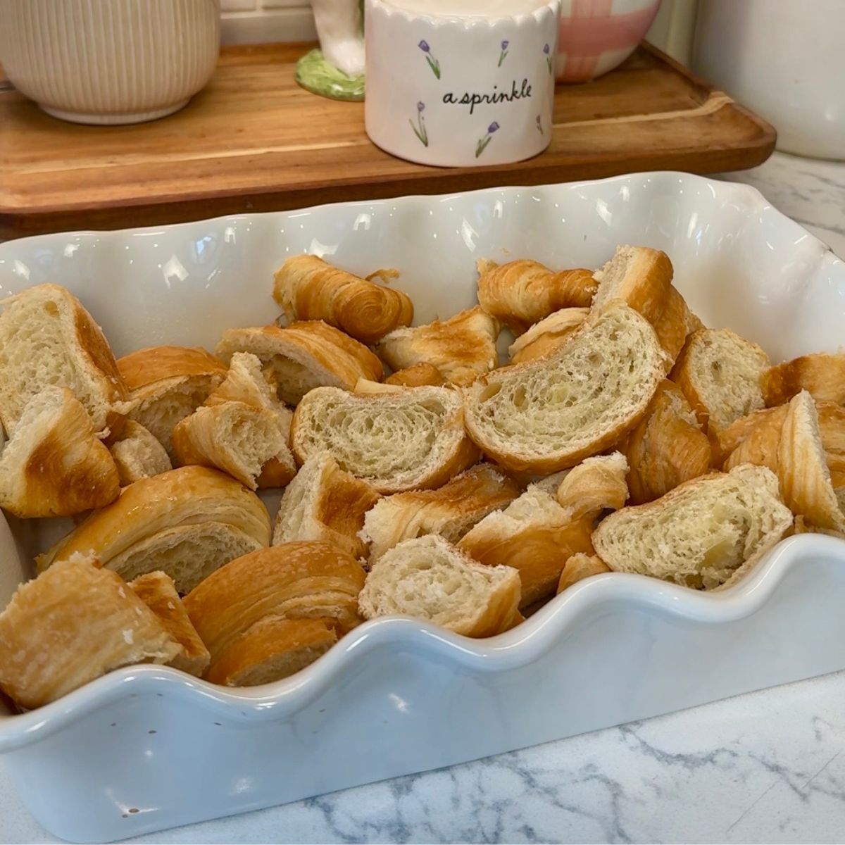 sliced croissants in white pan