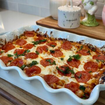 pizza pasta bake in white casserole dish