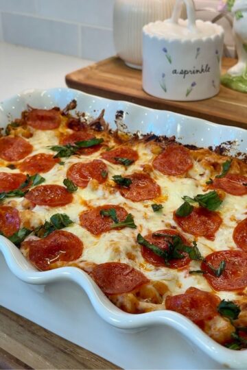 pizza pasta bake in white casserole dish