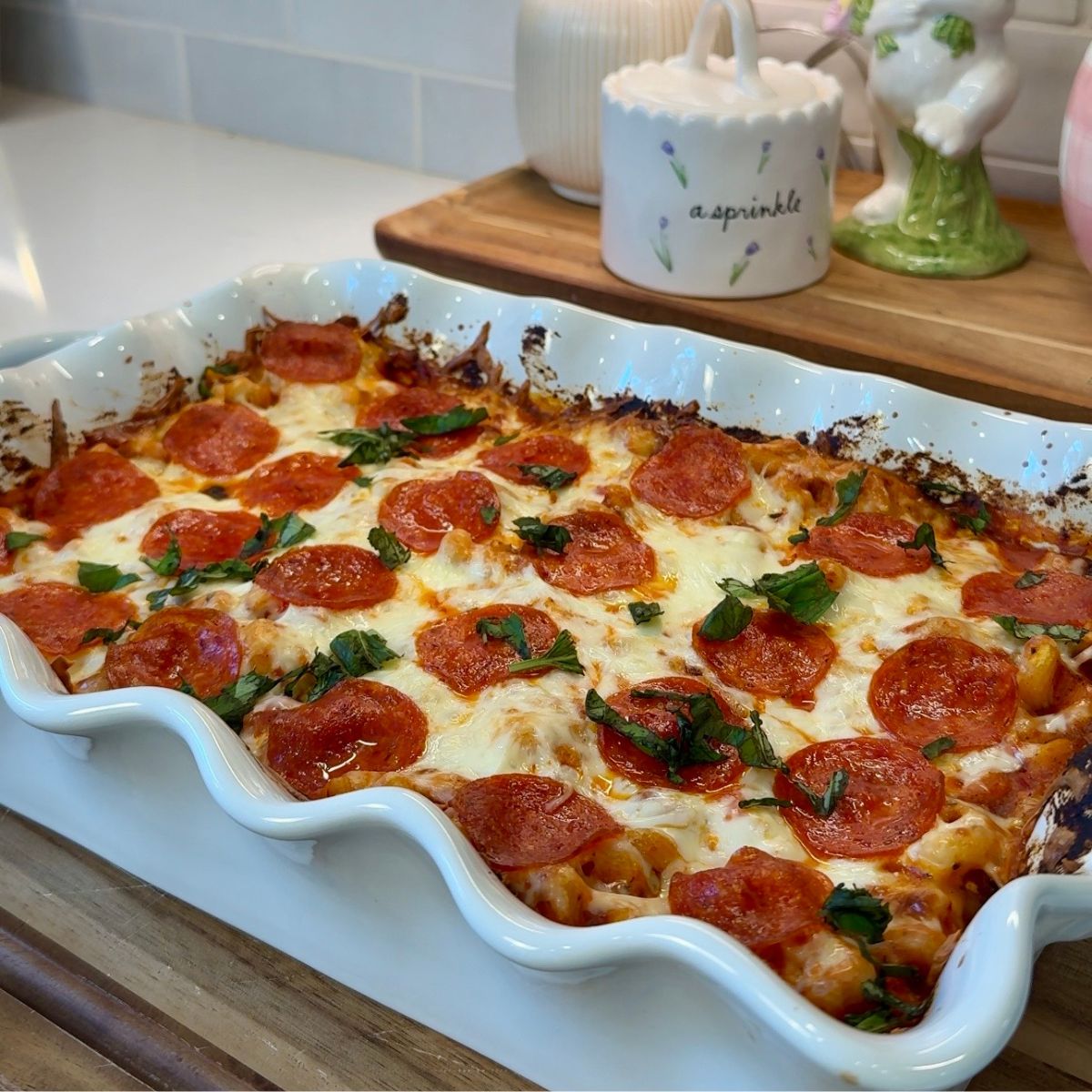 pizza pasta bake in white casserole dish