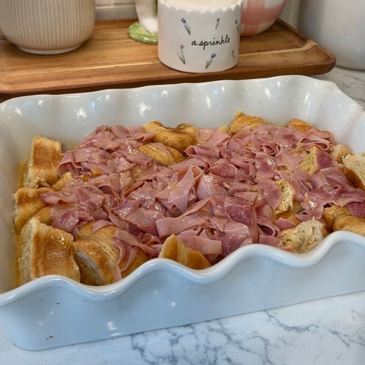ham and egg mixture in white casserole dish