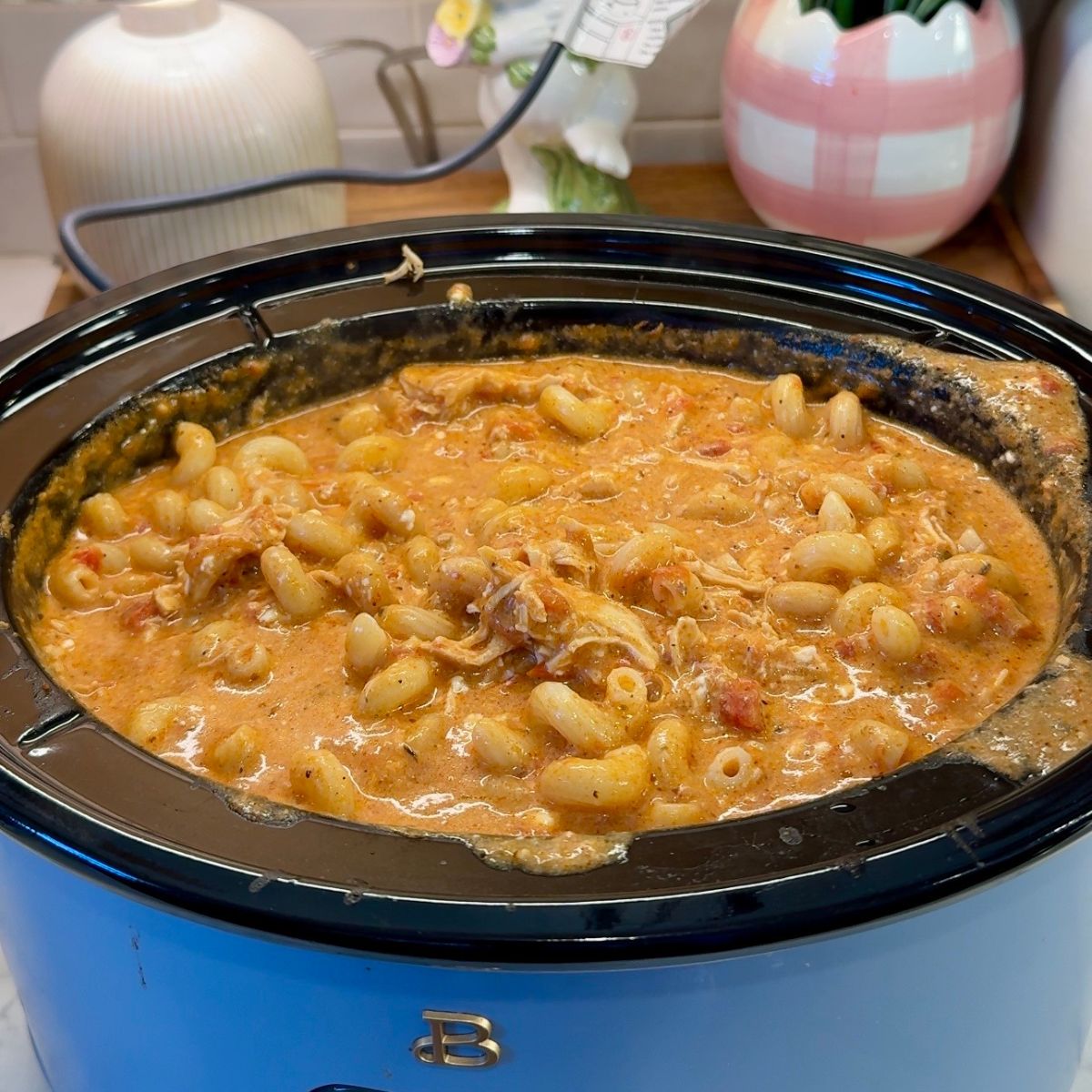 pasta added into creamy chicken sauce