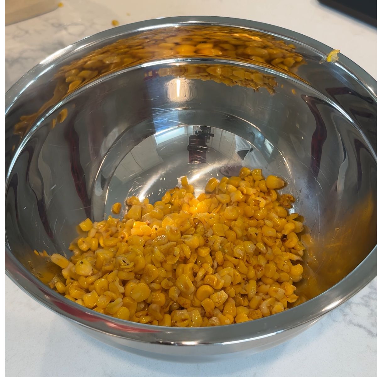 corn in silver mixing bowl