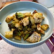 one pan garlic parmesan chicken on green plate with potatoes and broccoli