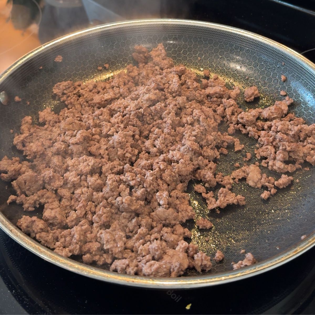 cooked ground beef on skillet