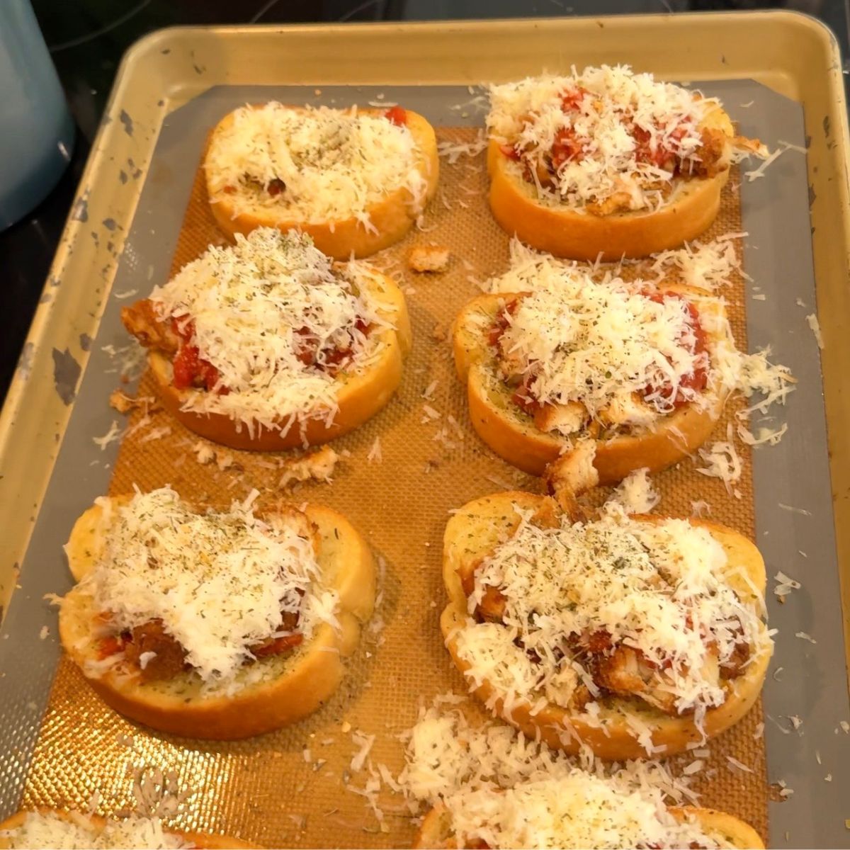 cooked chicken parmesan texas toast on pan 