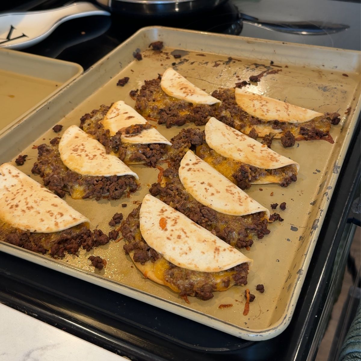 baked beef tacos on baking tray