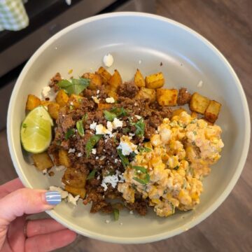 hot honey ground beef with street corn salsa, lime wedge, and potatoes