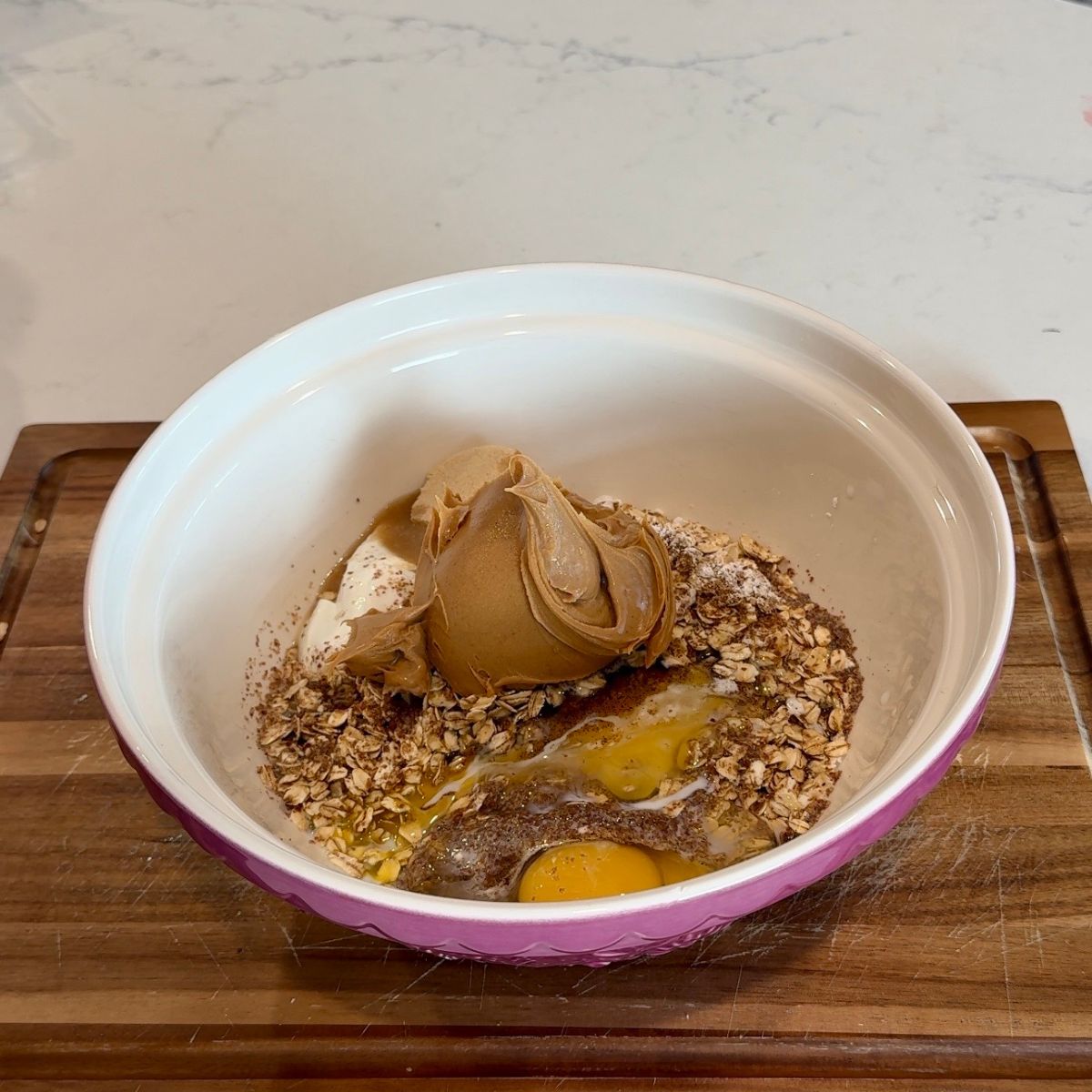 peanut butter on top of oats in bowl