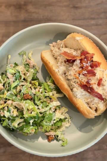 crockpot marry me chicken sandwich with salad on green plate
