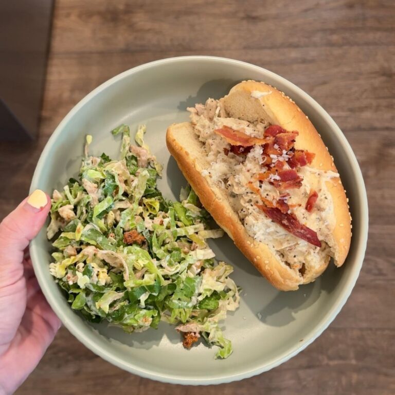 crockpot marry me chicken sandwich with salad on green plate