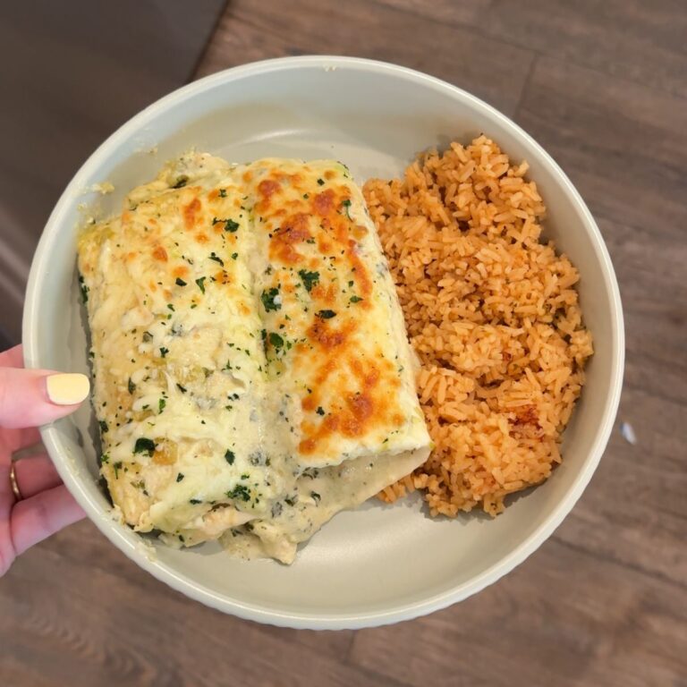 salsa verde chicken enchiladas with rice on green plate