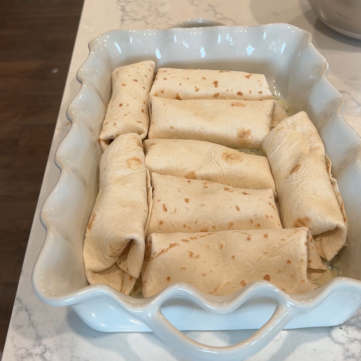 8 rolled tortillas in casserole dish