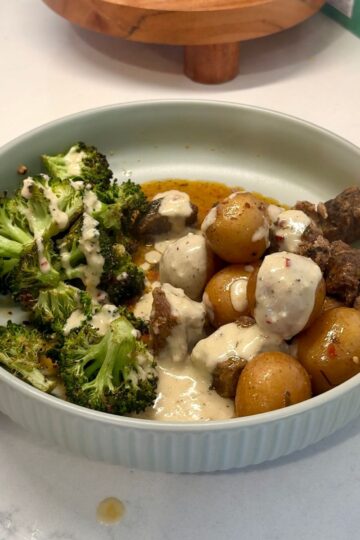 crockpot cowboy butter steak bites with broccoli and cream sauce